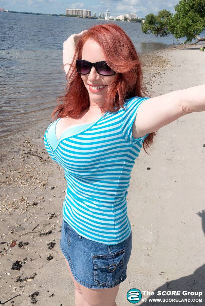 Natural redhead Red Vixen releases her big tits from a bathing suit in shades - #9