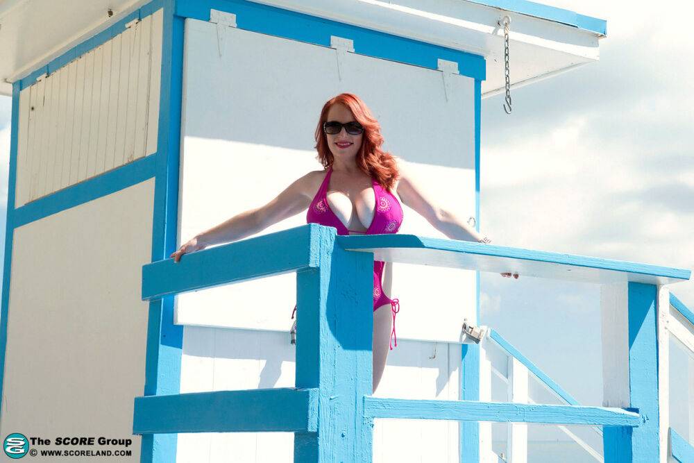 Natural redhead Red Vixen releases her big tits from a bathing suit in shades - #11