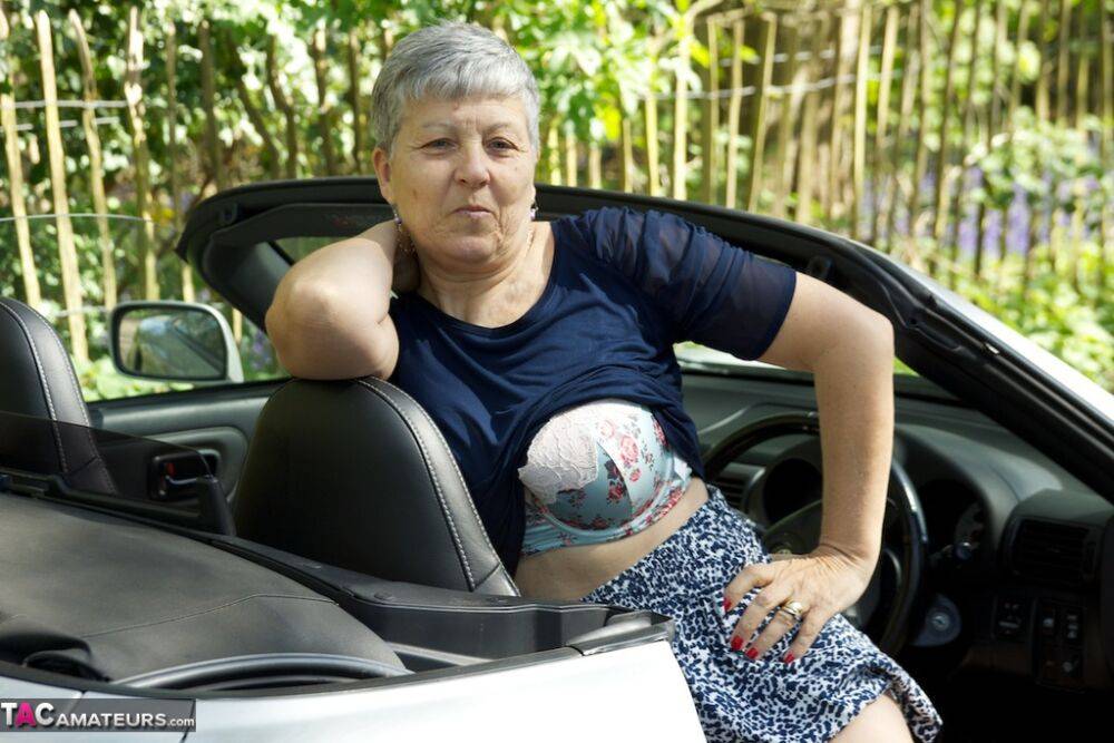 Horny granny Savana peels outdoors to model her big saggy tits on her car - #3