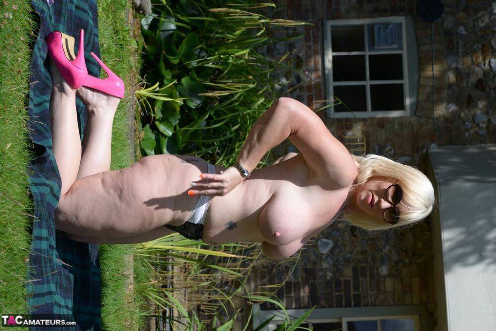 Overweight older blonde Melody displays her big naturals in a backyard setting - #12