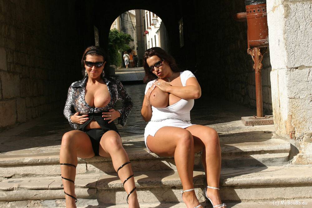 Lesbian women Aneta Buena & Kora Kryk play with their big tits in public - #5