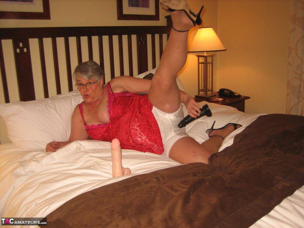 Fat granny Girdle Goddess whips out her big boobs on a bed in pantyhose - #3