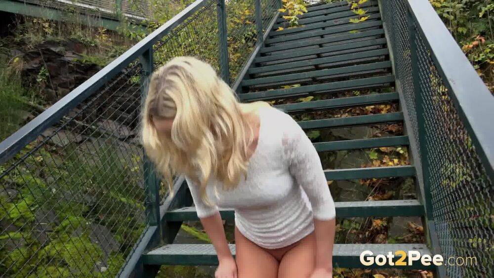 Blonde Victoria Pure pulling down her tight pants to pee on the bleachers - #9