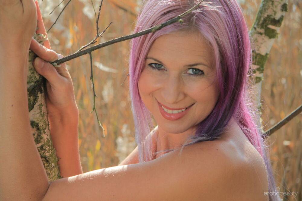 Busty female Anastasia Devine sports dyed hair while naked in the woods - #4