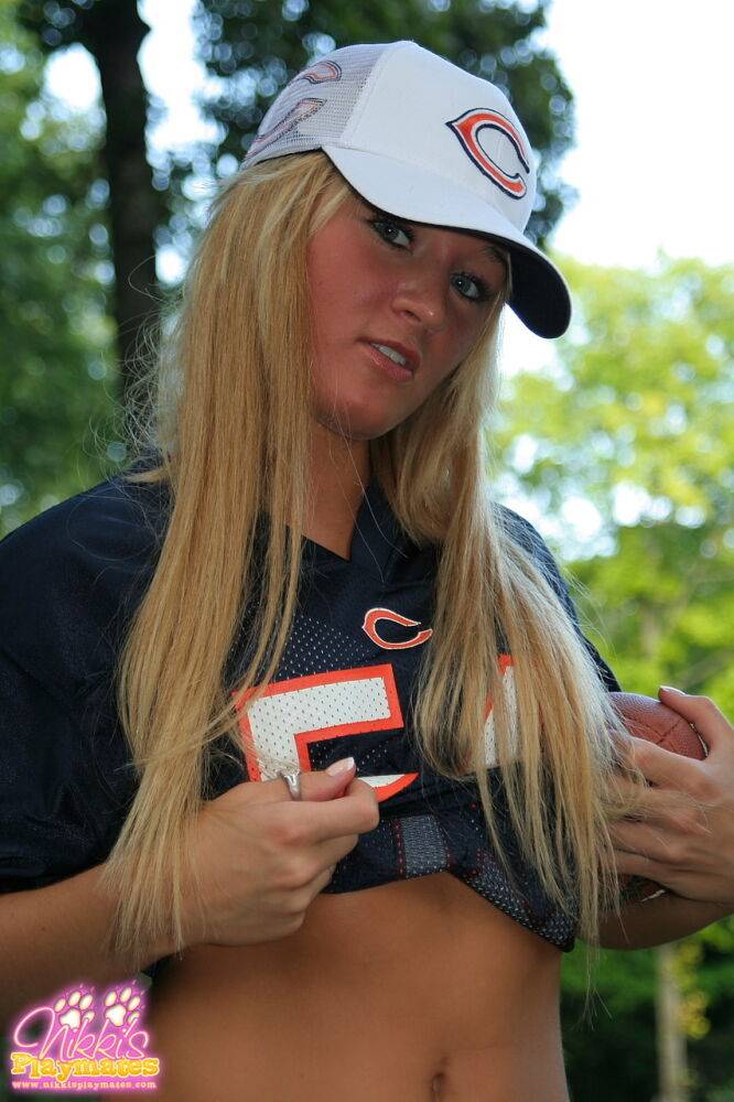 Blonde amateur Roxy Bears holds a football during hot SFW poses on a lawn - #7