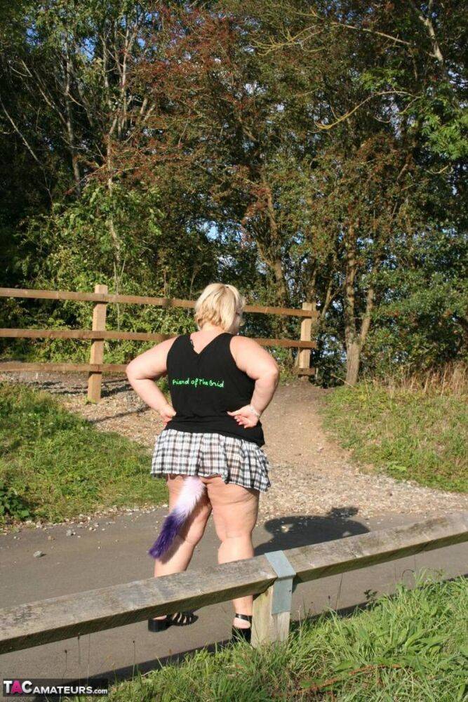 Overweight UK blonde Lexie Cummings shows her tail butt plug in the outdoors - #4