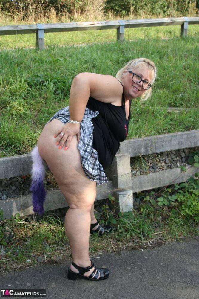 Overweight UK blonde Lexie Cummings shows her tail butt plug in the outdoors - #16
