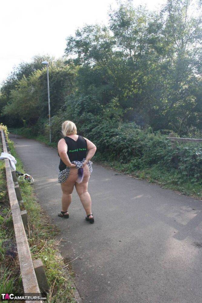 Overweight UK blonde Lexie Cummings shows her tail butt plug in the outdoors - #5
