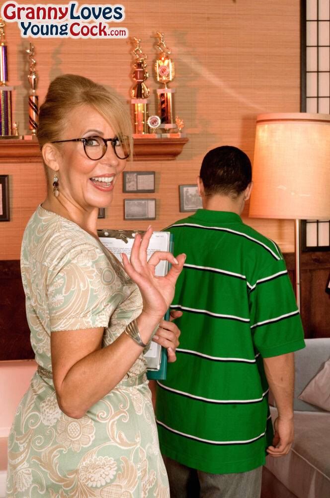 Glasses wearing granny Erica Lauren gives young boy his first sex lessons - #1