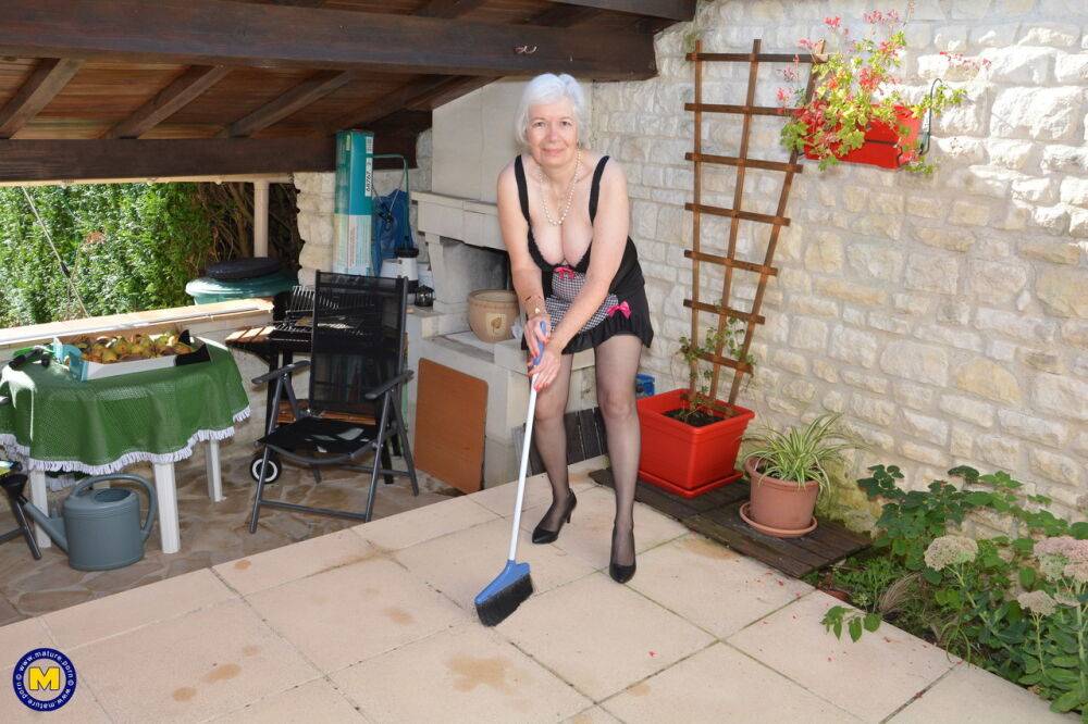 Horny granny lifts her sexy skirt to play with her beaver in the garden - #3