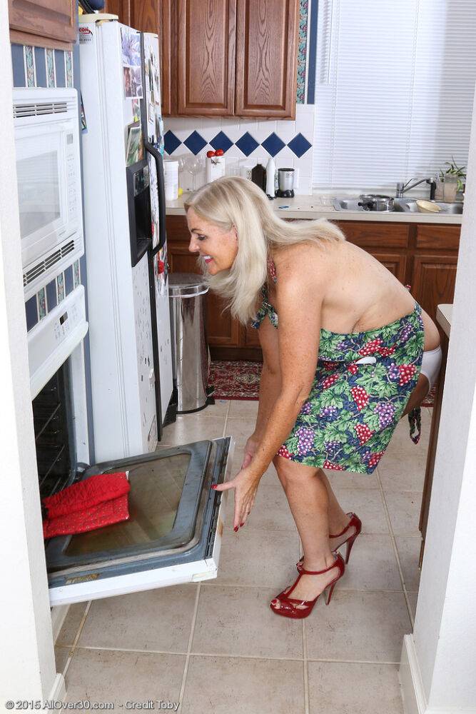 Horny mature housewife Judy Mayflower masturbates with kitchen implements - #14