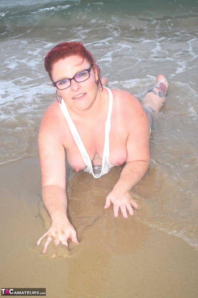 Tattooed redhead wades into the ocean before exposing herself - #5