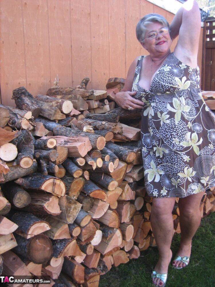 Brazen older granny strips off by the wood pile to show off BBW tits & big ass - #3