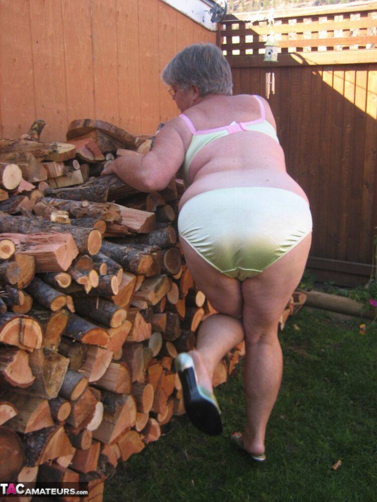 Brazen older granny strips off by the wood pile to show off BBW tits & big ass - #8