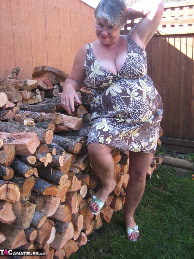 Brazen older granny strips off by the wood pile to show off BBW tits & big ass - #6