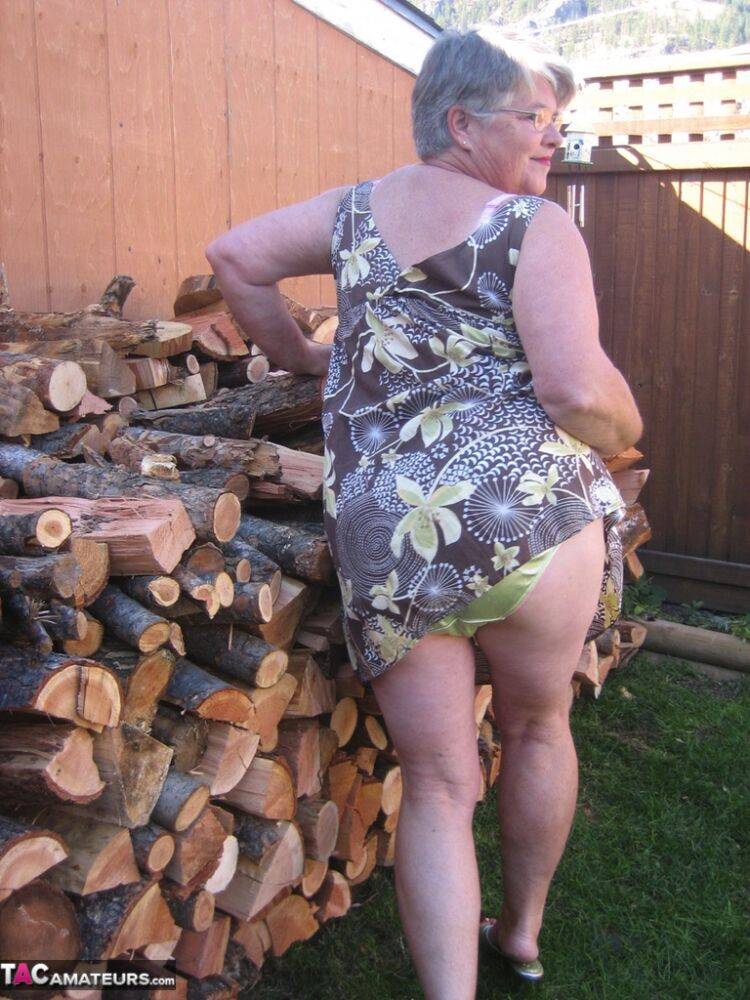 Brazen older granny strips off by the wood pile to show off BBW tits & big ass - #12