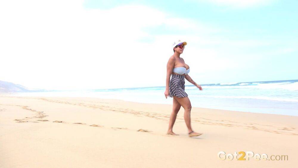 Caucasian female Chloe takes a piss while while traipsing on a deserted beach - #4