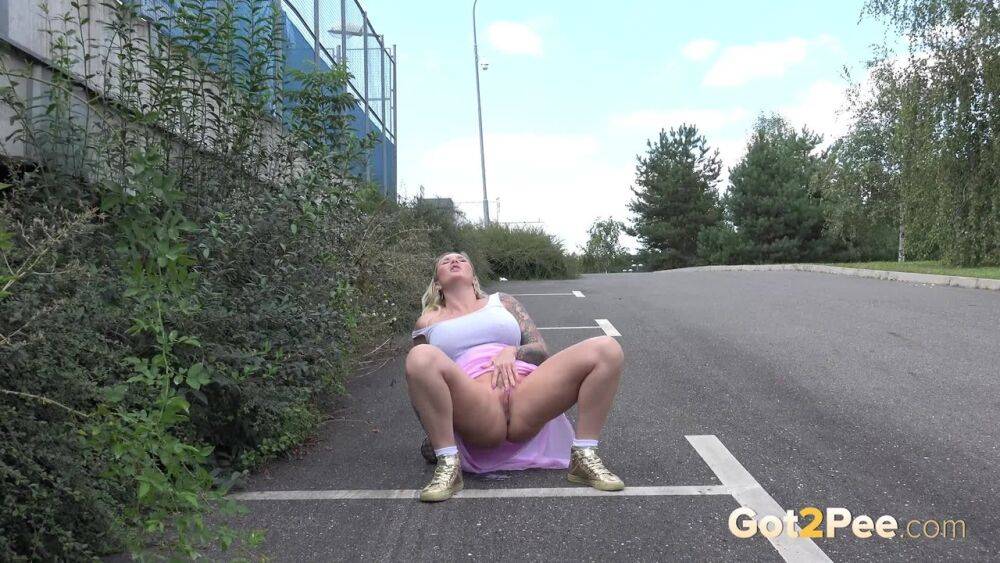 Mature fatty Lily shows her naked pussy in the parking lot while peeing - #1