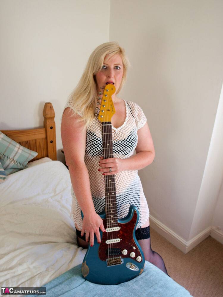 Blonde BBW Samantha touches her pussy while holding an electric guitar - #9