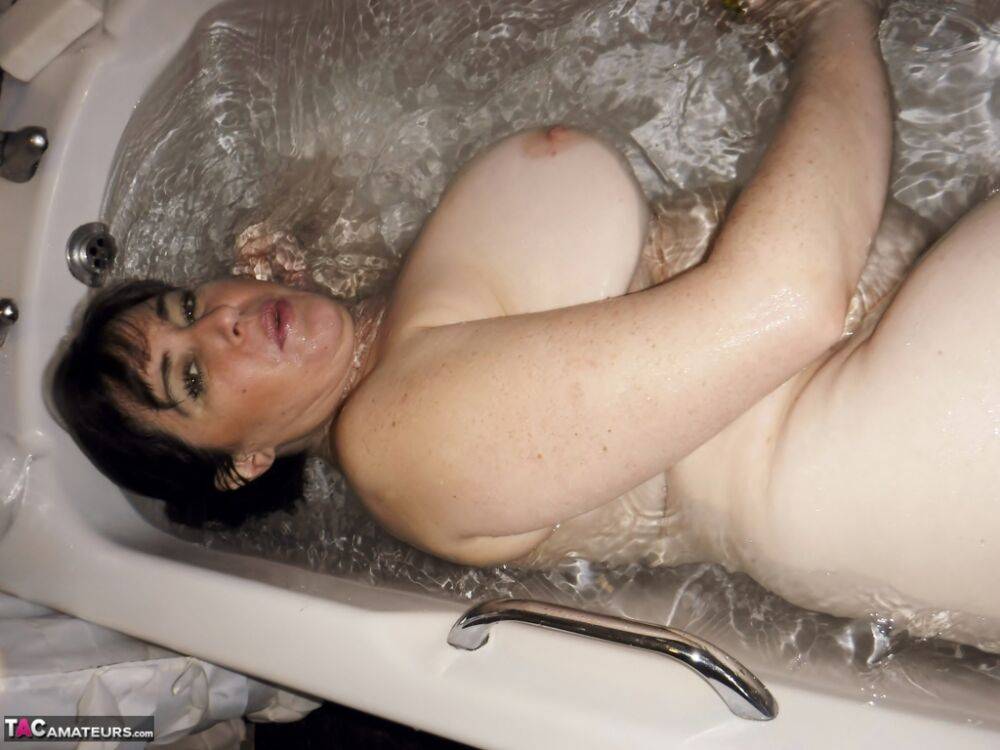 British amateur Juicey Janey gets caught totally naked while in a full bathtub - #1