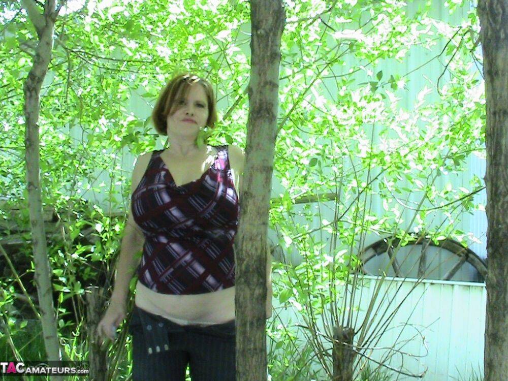 Thick older woman Misha MILF exposes herself in a stand of hardwood trees - #3