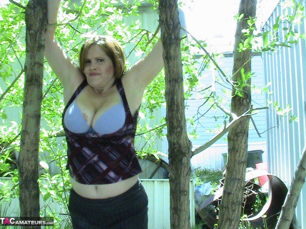 Thick older woman Misha MILF exposes herself in a stand of hardwood trees - #15