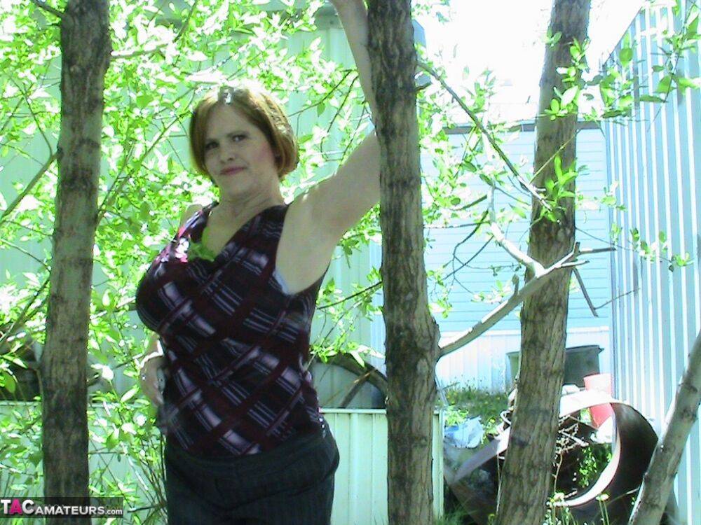 Thick older woman Misha MILF exposes herself in a stand of hardwood trees - #9