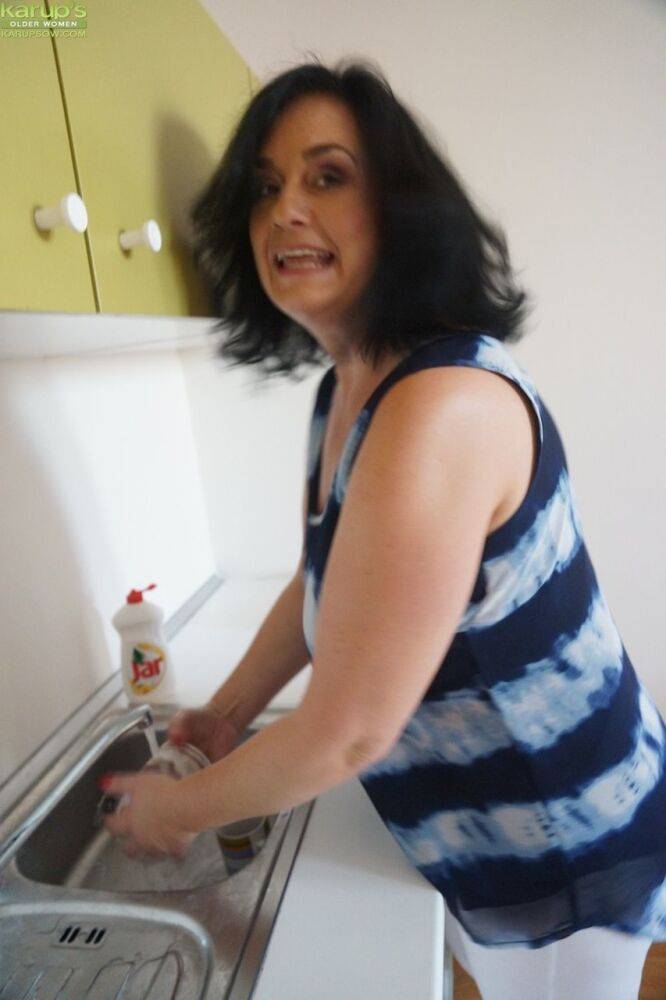 Older housewife Ria Black strips after washing up dishes to finger her pussy - #14