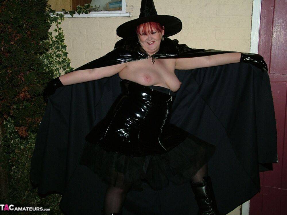 Older redhead Valgasmic Exposed displays her pussy in cosplay wear by the shed - #10