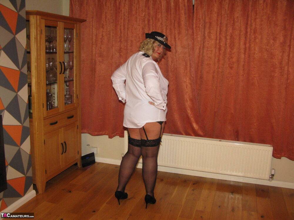 Mature policewoman Chrissy Uk looses her tits and twat from her uniform - #10