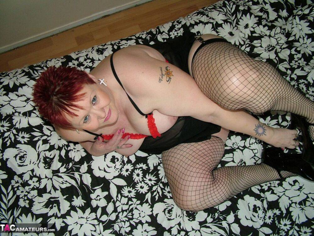 Older redhead Valgasmic Exposed shows her tits and twat in mesh hosiery - #8