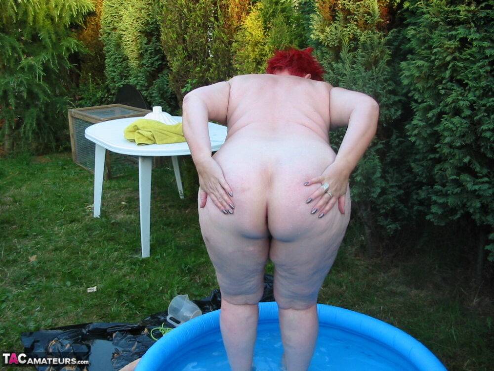 Older redheaded BBW Valgasmic Exposed plays with a dildo in a wading pool - #15