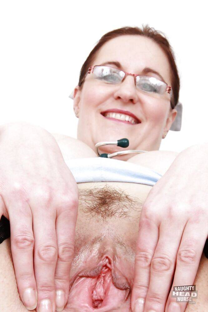 Chubby nurse in glasses exposing and fingering her hairy pussy - #9