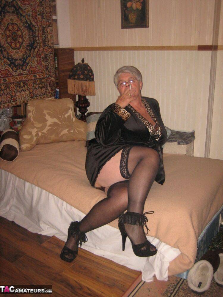 Silver haired granny Girdle Goddess masturbates on her bed in stockings - #7