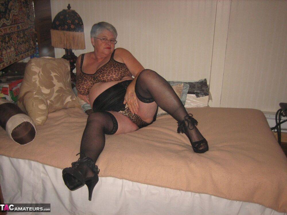 Silver haired granny Girdle Goddess masturbates on her bed in stockings - #13