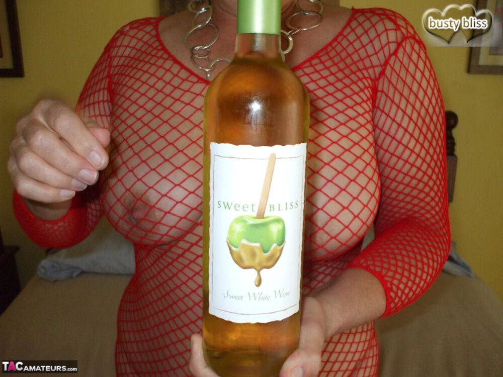 Mature amateur Busty Bliss gives a blowjob while drinking a bottle of wine - #16