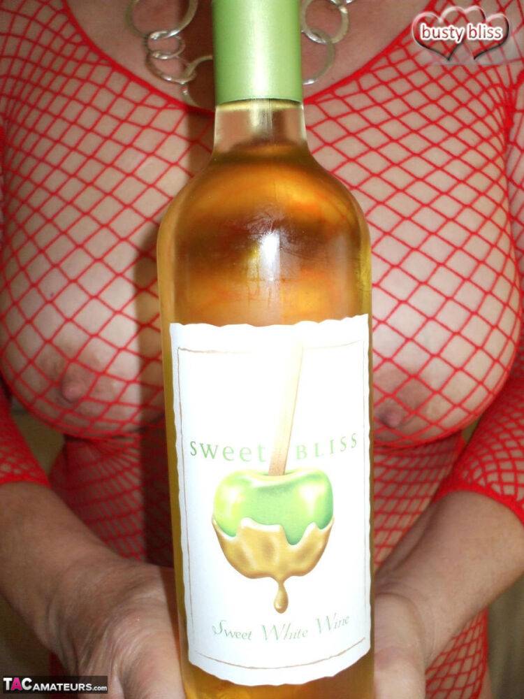 Mature amateur Busty Bliss gives a blowjob while drinking a bottle of wine - #14