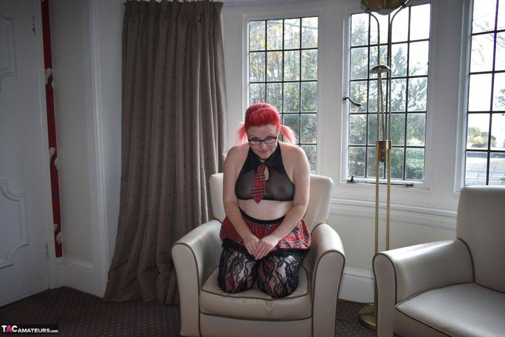 Thick older redhead Mollie Foxxx fingers and toys her cunt on a chair | Photo: 4404905