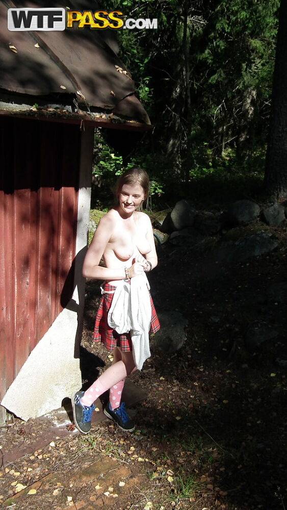 Solo girl shows her tits and twat while forcing entry into abandoned cabin | Photo: 4491459