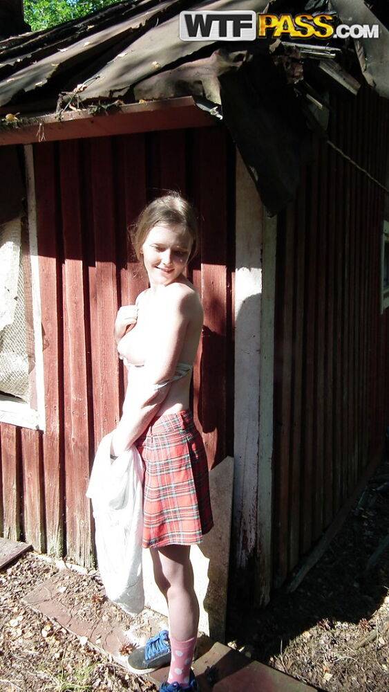 Solo girl shows her tits and twat while forcing entry into abandoned cabin - #8