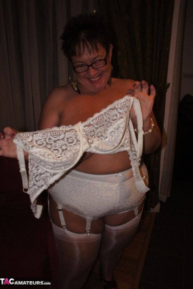 Older BBW Warm Sweet Honey sets her large tits free in hose and girdle panties - #6