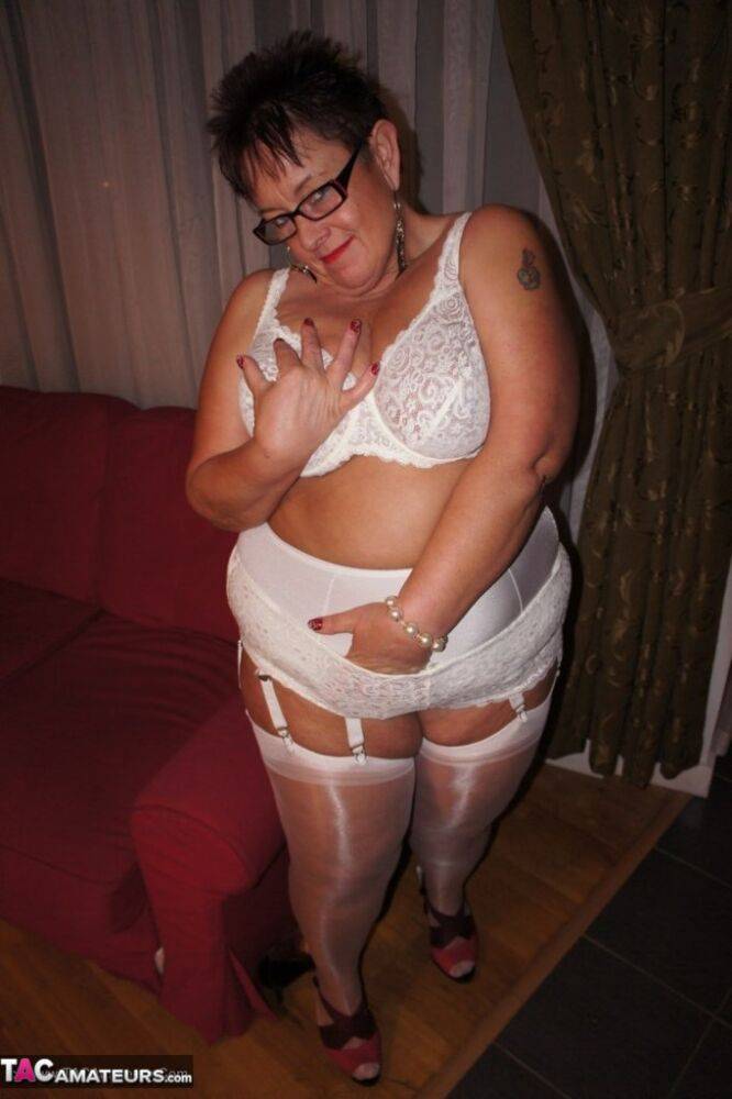 Older BBW Warm Sweet Honey sets her large tits free in hose and girdle panties - #12