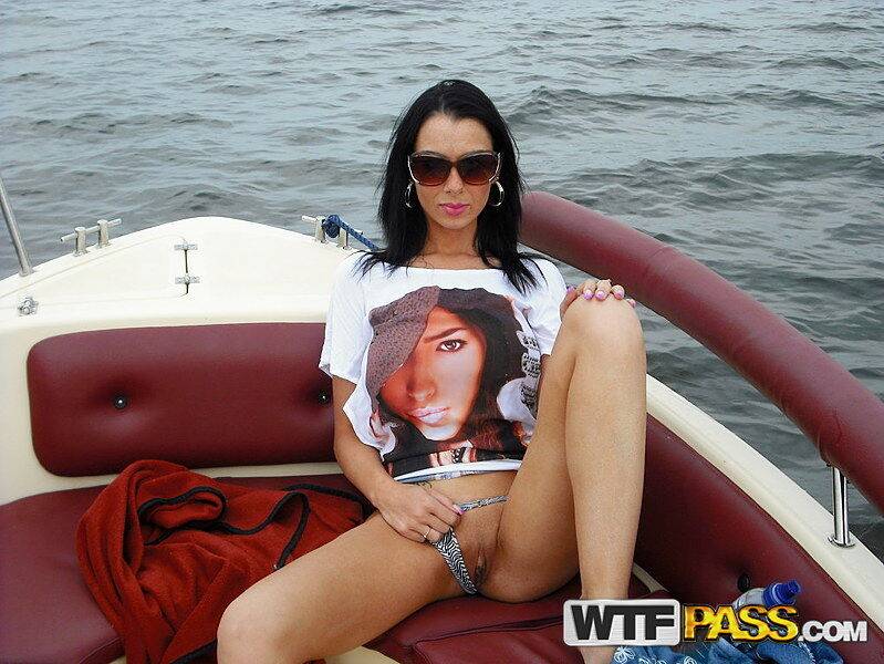 Brunette amateur shows her tits and pussy on a speed boat out on the water - #6