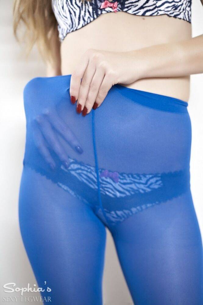 Blonde model Sophia Smith pulls her blue hose over her panty laden butt - #11