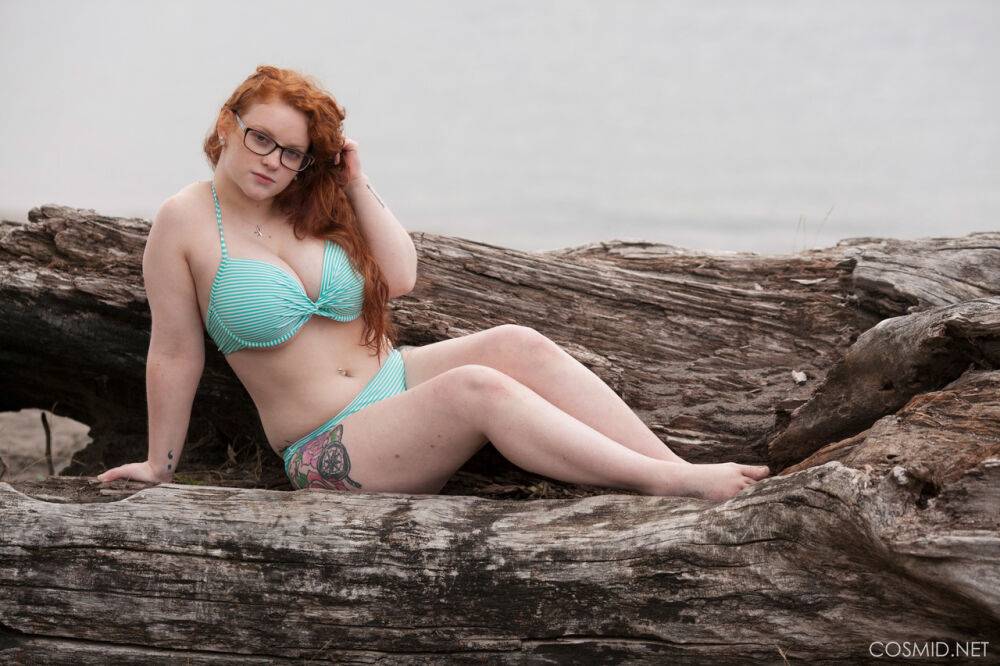 Sexy plump redhead Kaycee Barnes posing naked outdoors wearing glasses - #6