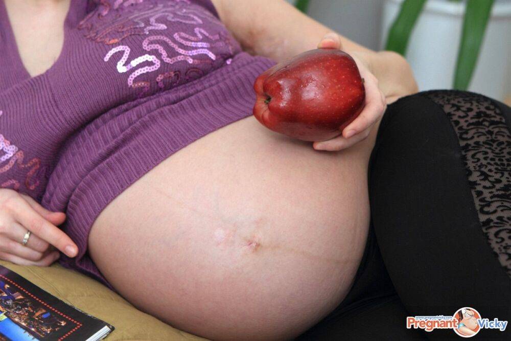 Pregnant girl finds sexual relief on a bed with a banana - #10