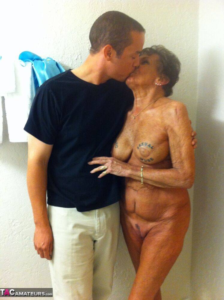 Dirty amateur granny shows her sexy naked body and kisses a young stud - #1