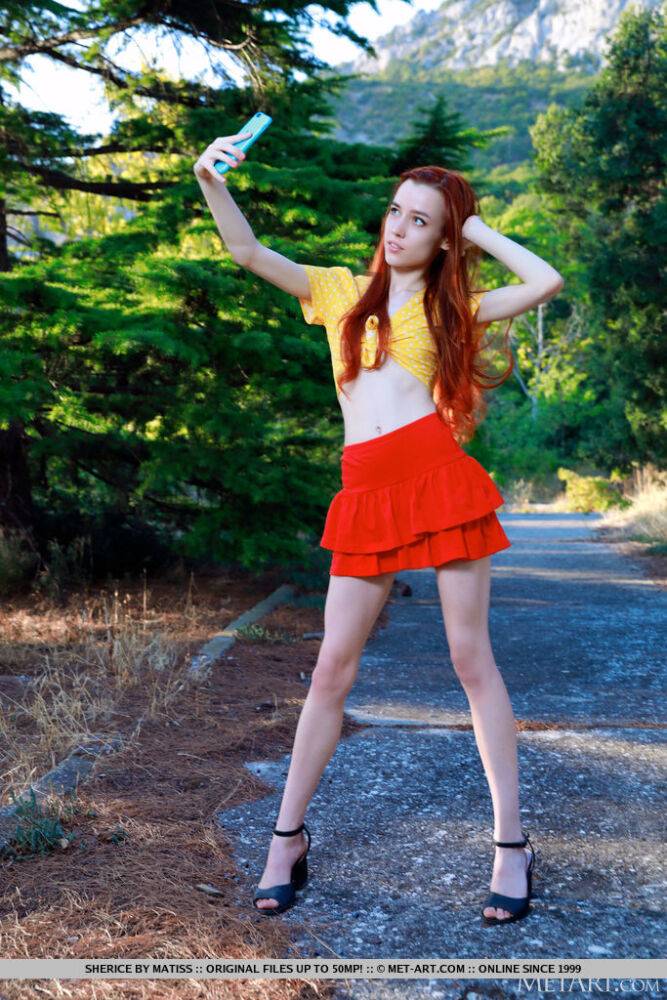 Young redhead Sherice gets totally naked after taking selfies on a forest path - #9