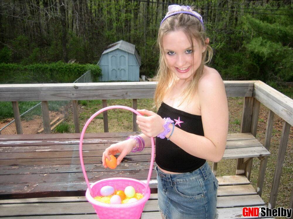 Charming young girl exposes a nipple while collecting Easter eggs - #5
