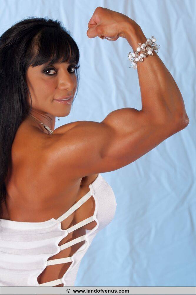 Female bodybuilder releases her muscled body from a revealing dress - #5